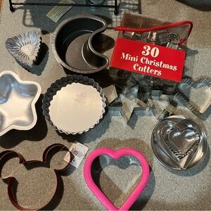Great collection of cookie cutters and pie tins